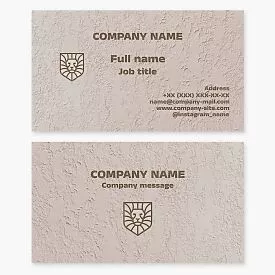 Business card template featuring a lion's head in a shield shape.