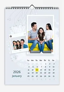 A calendar template featuring a happy family with their daughter on a pastel blue background with plant designs. Printed photos on framed paper, one of which is a Polaroid with social media-style information.