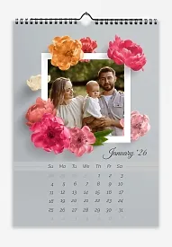 Calendar template: Young family with a child in a frame with large bright flowers on a gray background.