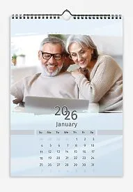 A light blue calendar template featuring an elderly couple. The photos are large and torn. The background is a soft pastel blue.
