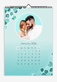 A fresh calendar template featuring a young couple on a menthol background with tree branches.