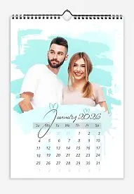 A simple azure calendar template featuring a cheerful bride and groom: large photos with brush-painted hearts.