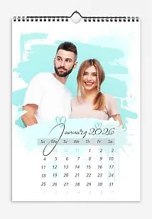 A simple azure calendar template featuring a cheerful bride and groom: large photos with brush-painted hearts.