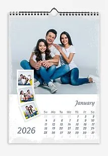 A happy family photo calendar template with grunge edges featuring a main photo and smaller photos in frames.
